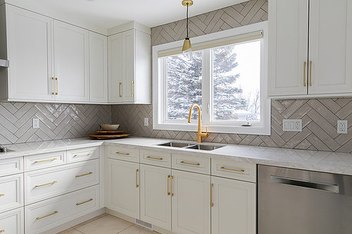 Kitchen cabinetry with textured backsplash