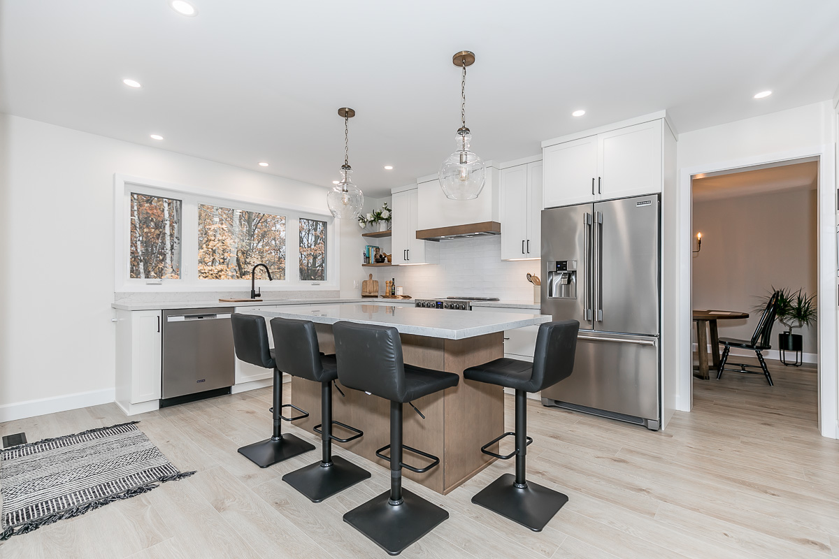 New Kitchen Complete with new island, custom range hood, new windows and lighting