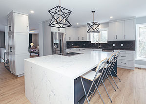 modern kitchen remodel with a waterfall island and new kitchen cabinetry