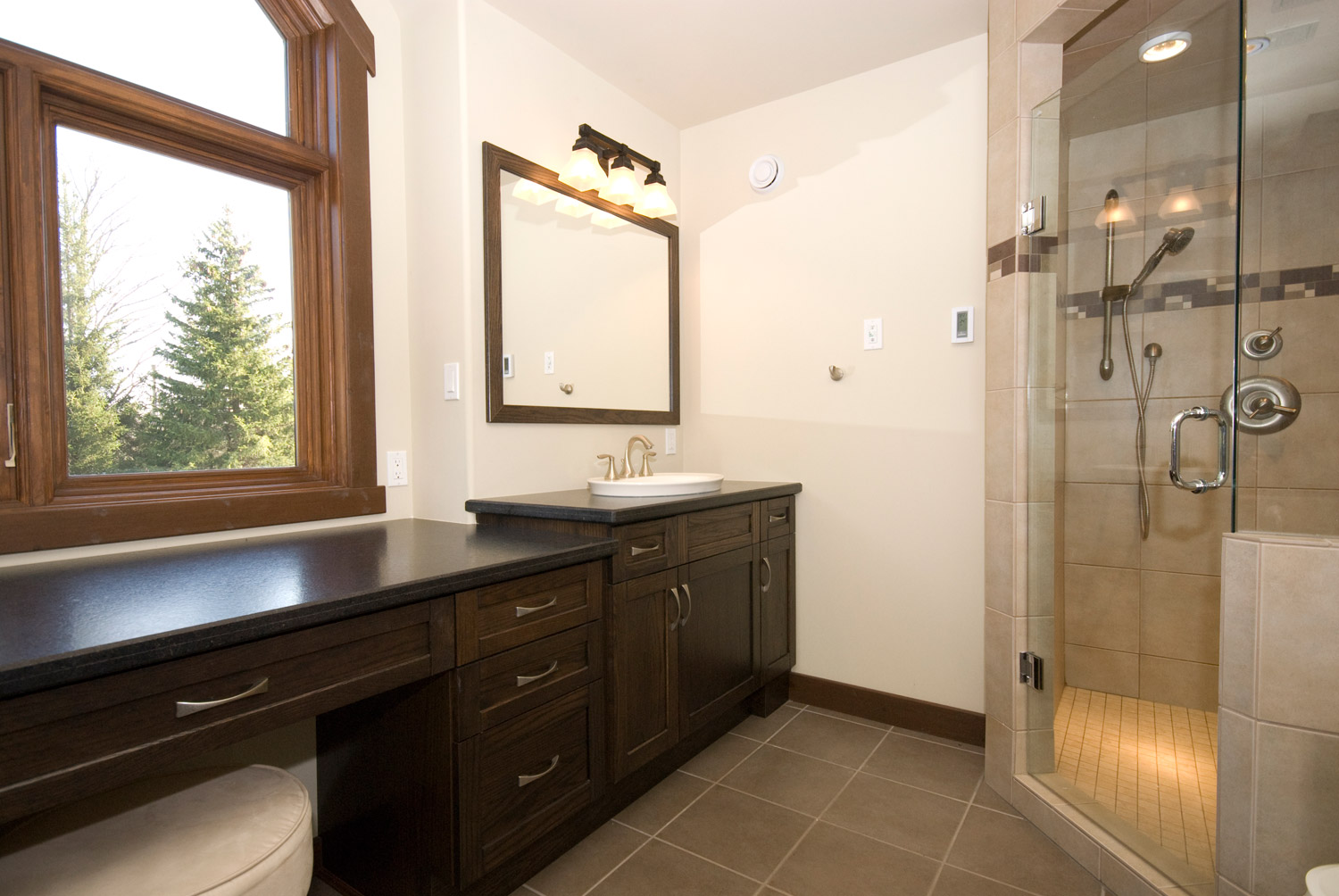 bathroom design with a large bathroom cabinet and a glass shower