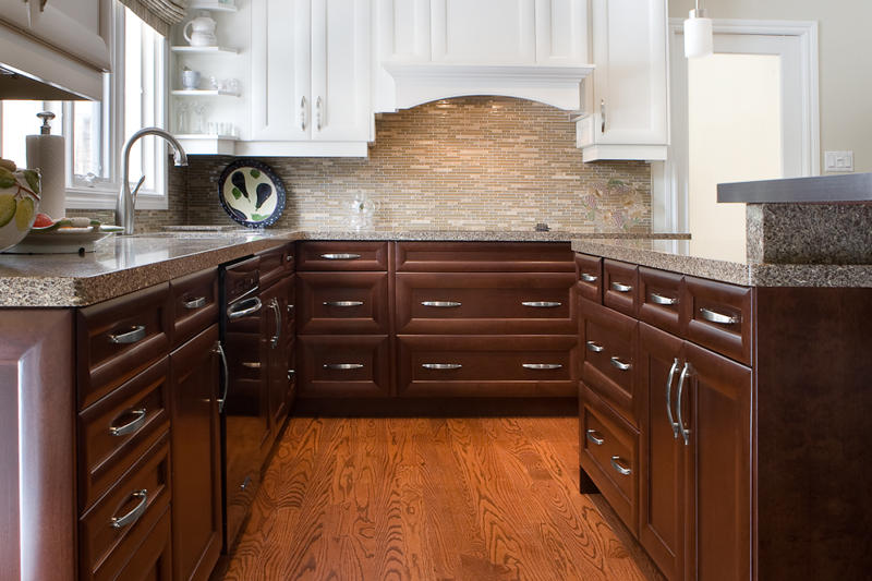Transitional kitchen design with a combination of white and dark wood cabinets - Total Living Concepts barrie ontario