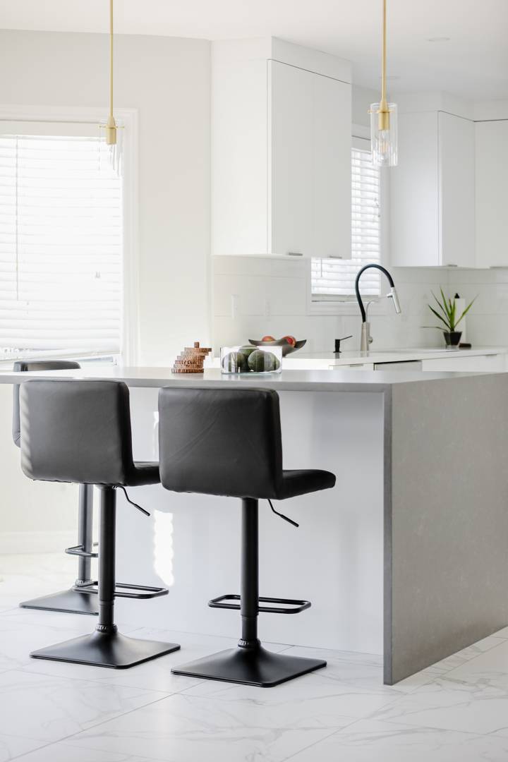 kitchen island with black chairs