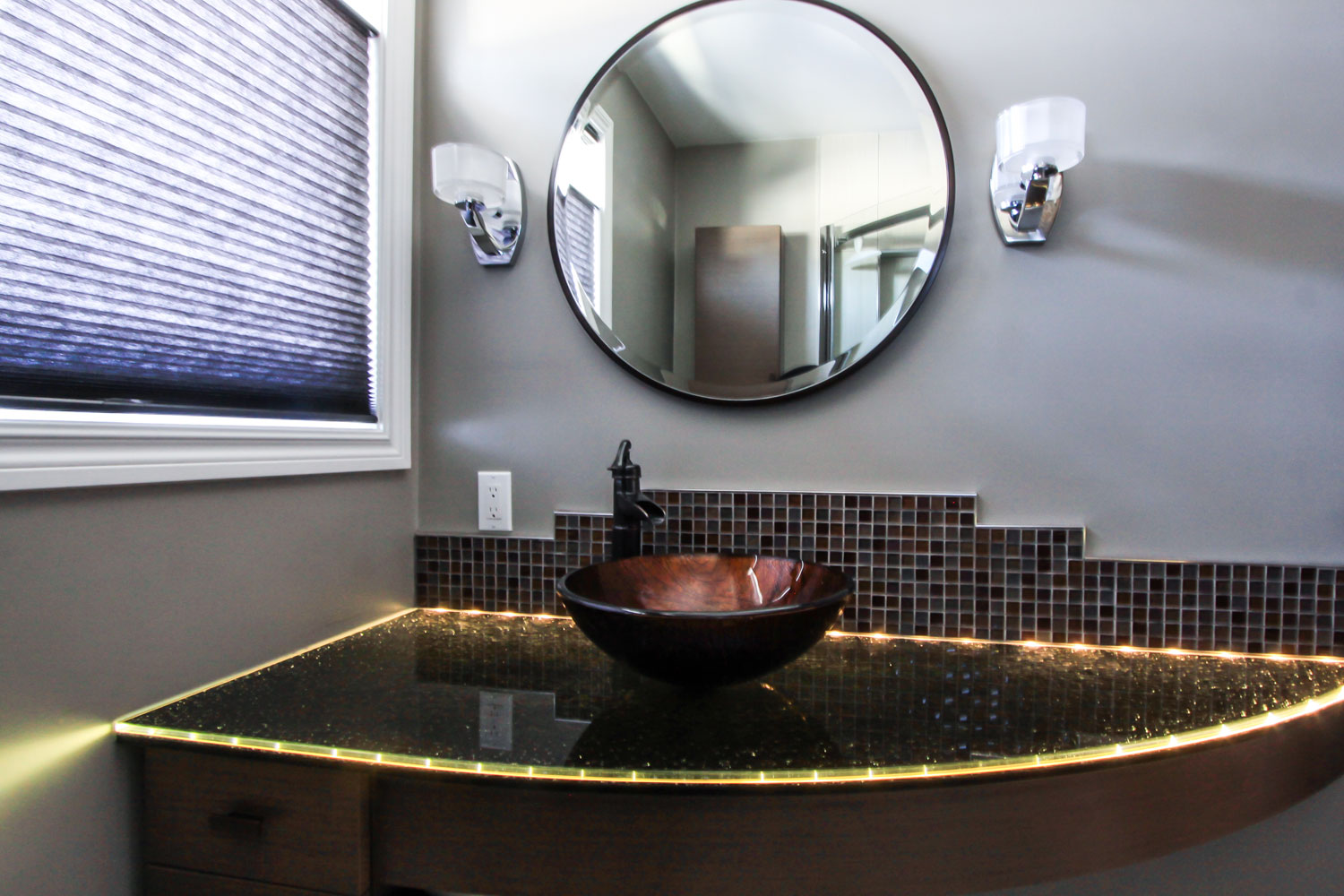 Bathroom vanity with a light strip around the countertop edge - Total Living Concepts