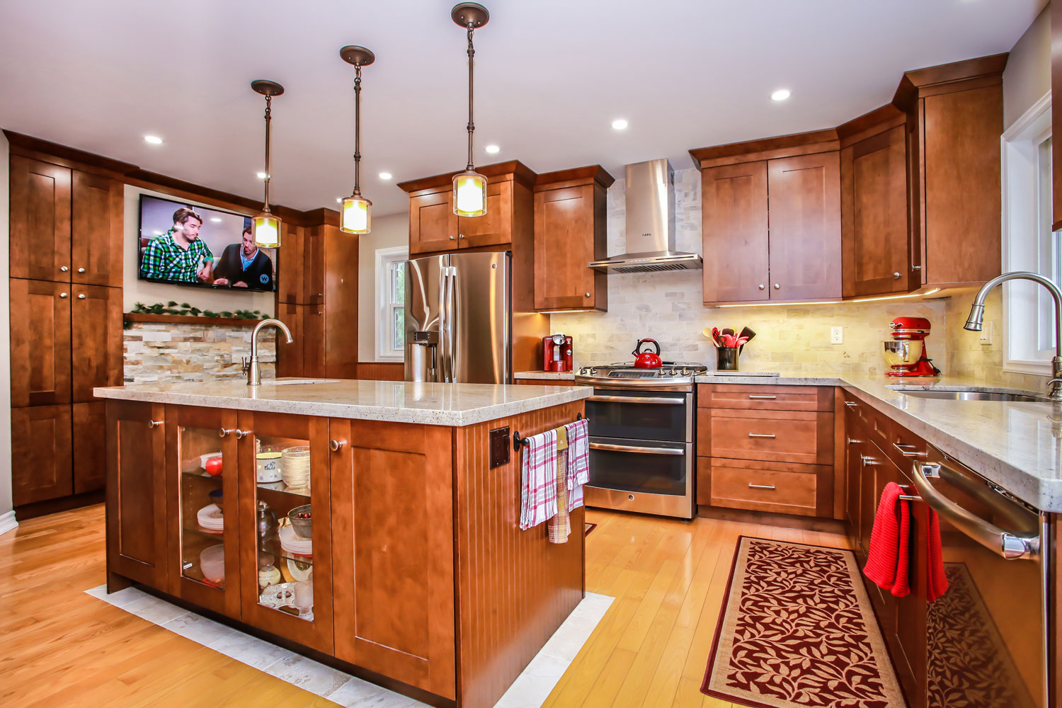 Modern counry kitchen design with cherry oak cabinets, stainless steel appliances, and a light hardwood floor - Total Living Concepts barrie ontario