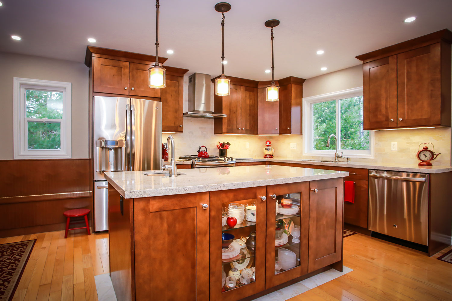 Kitchen cabinetry that includes a china cabinet display