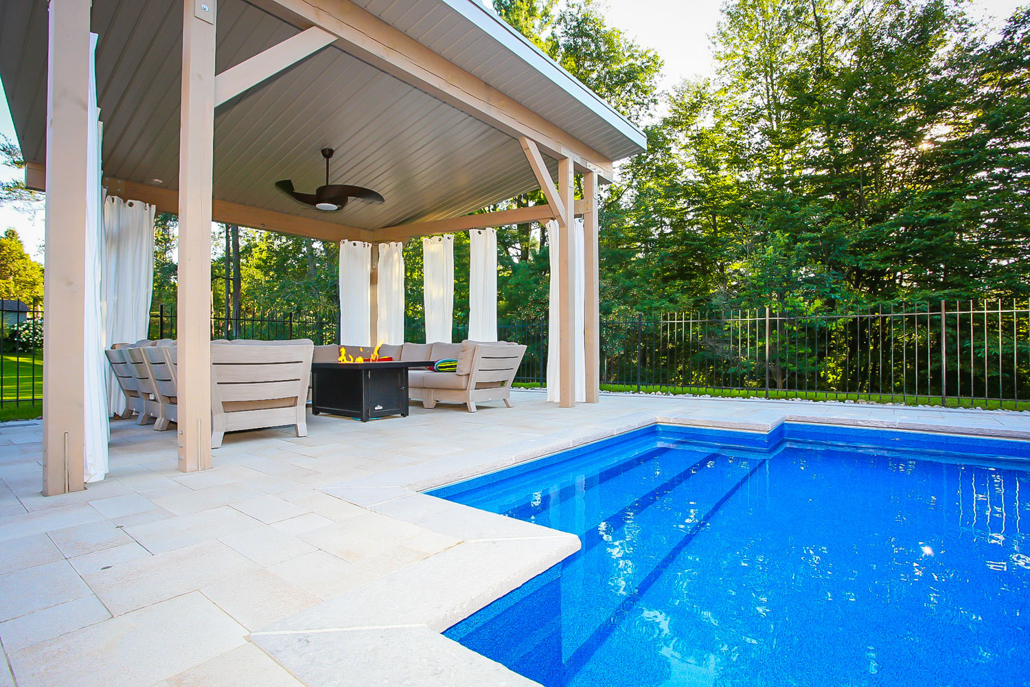 Outdoor home renovation project - a pool side cabana with a fireplace