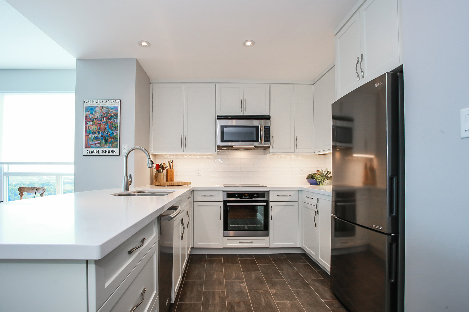 Small white kitchen design and renovation featuring white cabinets and stainless steel cabinets