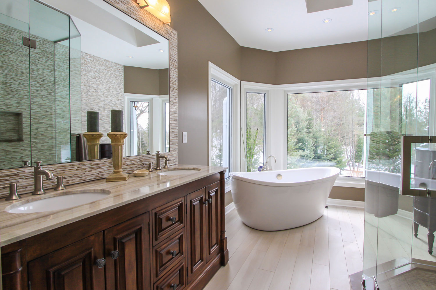Traditional large ensuite design with dual vanities, floating soaker tub, glass shower - Total Living Concepts barrie ontario