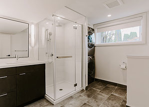 Bathroom design project with standup shower and stacked laundry area