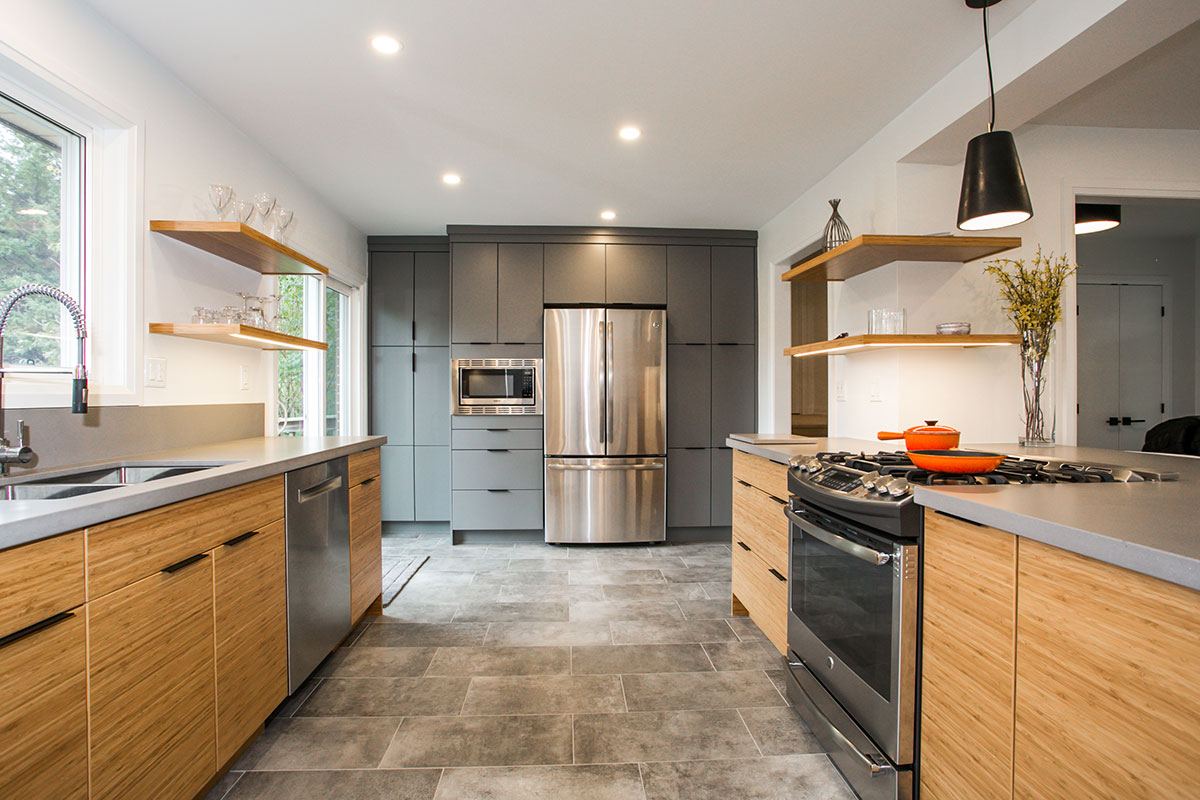 Modern transitional kitchen renovation in Barrie, Ontario featuring a mix of white, grey and wood tones, an abundance of storage, simple clean lines with open shelving, and an eat up bar with built-in wine fridge.